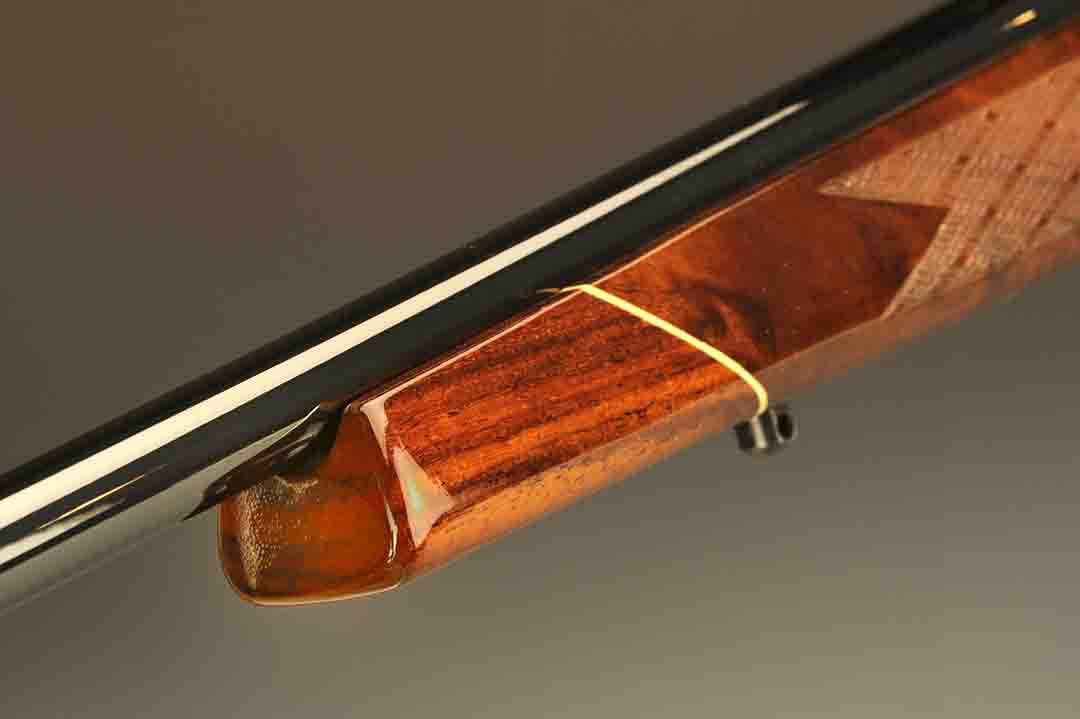 One can’t have a Weatherby rifle without the customary forend tip. Made from rosewood and including a white line spacer, it has been part of the Mark V since its beginning. Note the high shine of the barrel.